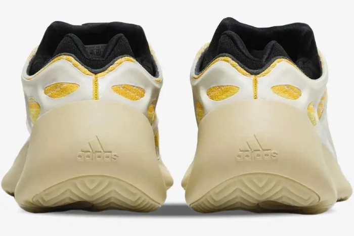 Rear view of Adidas Yeezy 700 V3 Safflower sneakers showing the cream heel and yellow knit upper. - SKU G54853