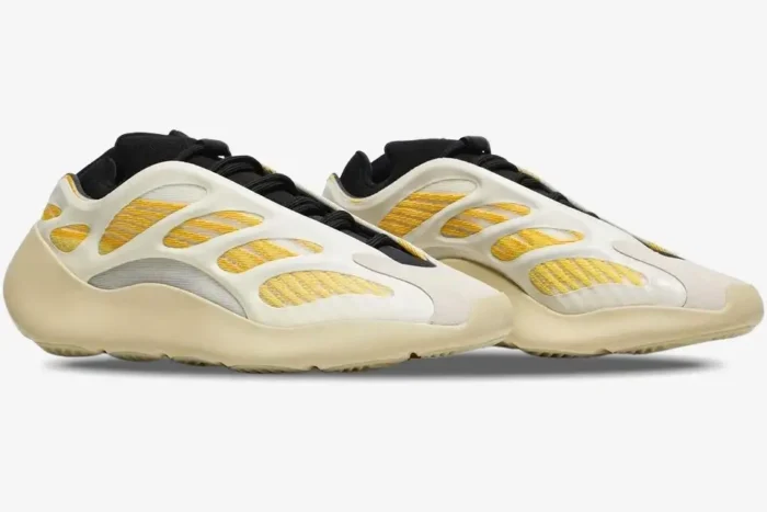 Adidas Yeezy 700 V3 Safflower sneakers in a side profile view with yellow and cream details. - SKU G54853