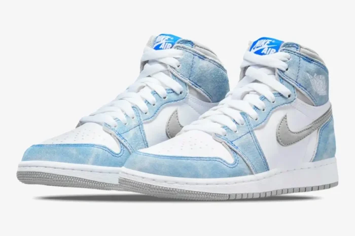 Air Jordan 1 Retro High OG Hyper Royal sneakers featuring faded blue suede and white leather, three-quarter view. - SKU 555088-402