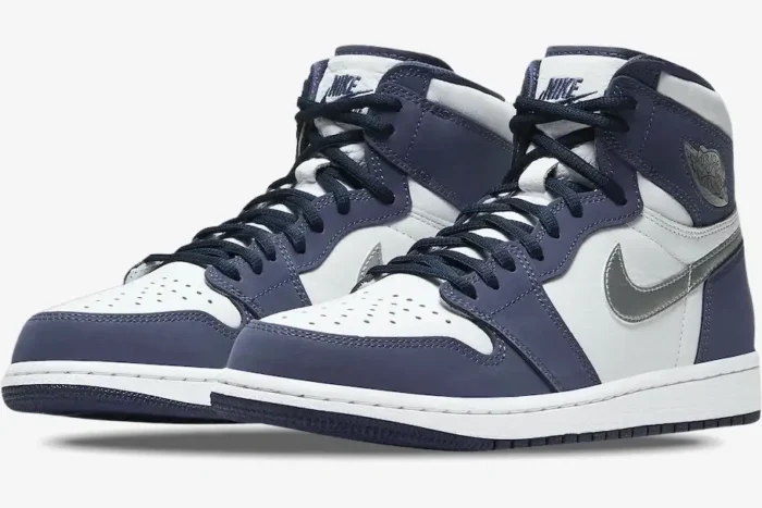Air Jordan 1 High Midnight Navy CO.JP sneakers in a three-quarter front view with white and navy leather. - SKU DC1788-100