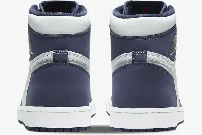 Rear view of Air Jordan 1 High Midnight Navy sneakers with white midsoles and navy suede heels. - SKU DC1788-100