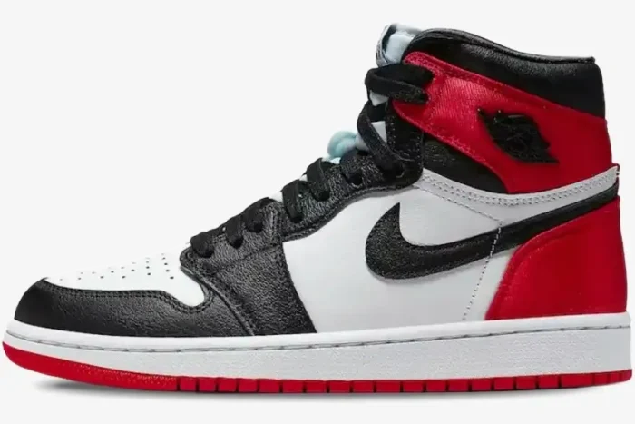 Side profile of the Air Jordan 1 High OG 'Bred Toe' sneaker in a red, black, and white colorway. - SKU 555088-610