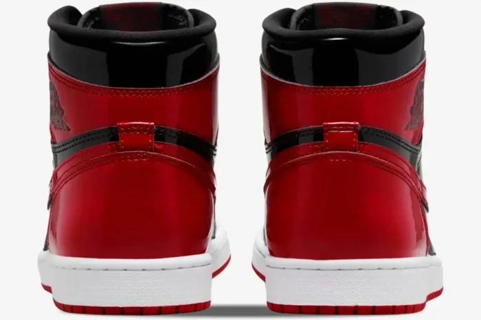 Rear view of Air Jordan 1 High OG Patent Bred sneakers in glossy red and black patent leather. - SKU 555088-063