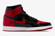 Side profile of the Air Jordan 1 High OG Patent Bred sneaker in black and red glossy patent leather. - SKU 555088-063