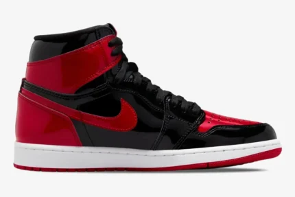 Side profile of the Air Jordan 1 High OG Patent Bred sneaker in black and red glossy patent leather. - SKU 555088-063