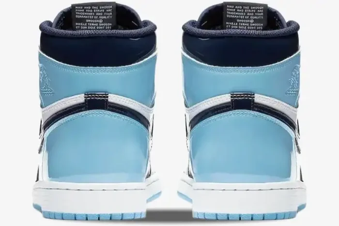 Rear view of Air Jordan 1 High UNC Patent Women's sneakers in light blue, dark blue, and white patent leather. - SKU CD0461-401