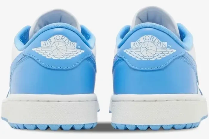 Rear view of Air Jordan 1 Low Golf 'UNC' University Blue sneakers with white wings logo on the heel. - SKU DD9315-100