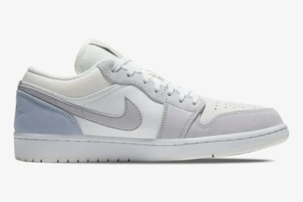 Air Jordan 1 Low Paris City Pack sneaker in white and grey, side profile view. - SKU CV3043-100
