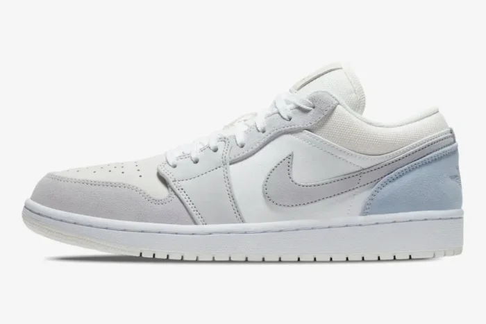 Side profile of Air Jordan 1 Low Paris City Pack in white, light grey, and sky blue suede. - SKU CV3043-100