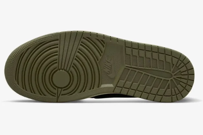 Bottom view of the Air Jordan 1 Low x Travis Scott Medium Olive sneaker showing the textured green rubber outsole. - SKU DZ4137-106