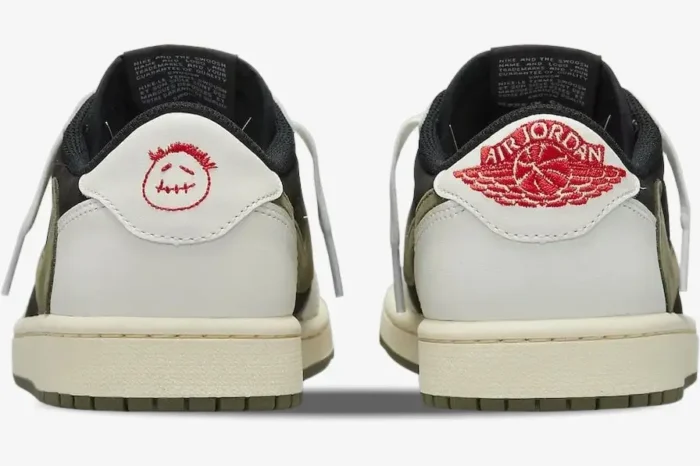 Rear view of Air Jordan 1 Low x Travis Scott Olive sneakers with red embroidered logos on white heels. - SKU DZ4137-106