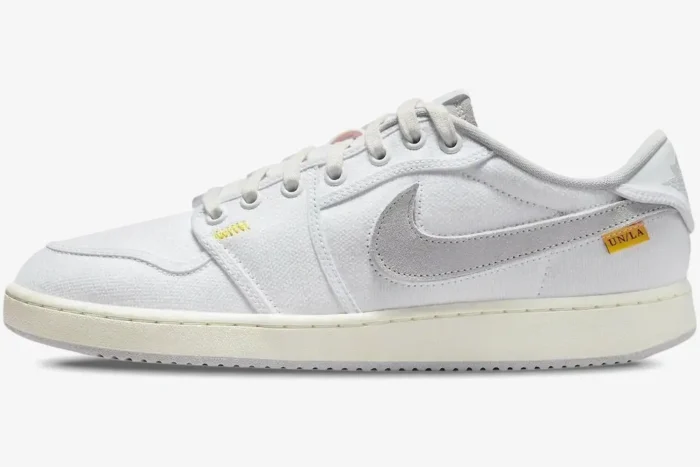 Side view of Air Jordan 1 Low x Union LA in white and neutral grey canvas with a grey suede swoosh. - SKU DO8912-101