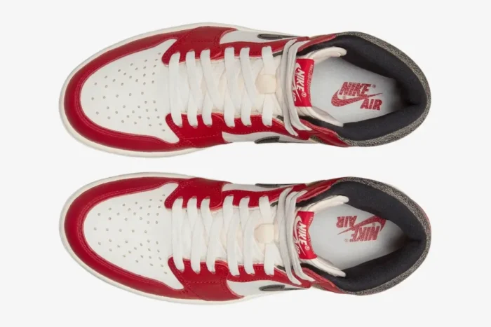 Top-down view of a pair of red and white Air Jordan 1 Retro High OG Chicago sneakers with white laces. - SKU 555088-101