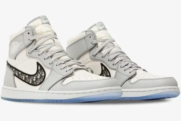 Air Jordan 1 Retro High x Dior sneakers in grey and white, side-angle view showing the Dior monogram swoosh. - SKU CN8607-002