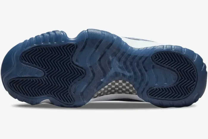 Bottom view of Air Jordan 11 Retro 'Midnight Navy' Velvet women's sneakers showing the blue translucent outsole. - SKU AR0715-441