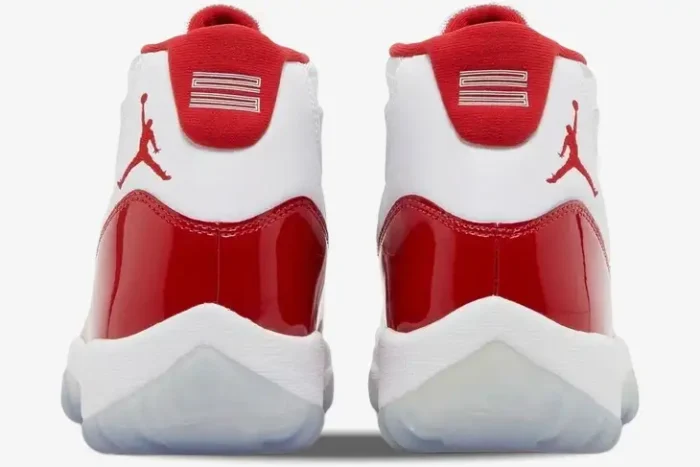 Rear view of Air Jordan 11 Retro Cherry sneakers in white and varsity red with patent leather. - SKU CT8012-116