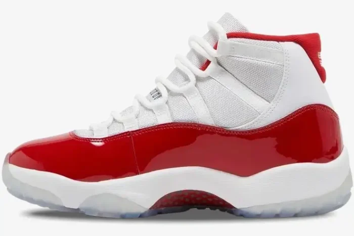 Side profile of Air Jordan 11 Retro Cherry sneakers in white and varsity red with patent leather. - SKU CT8012-116