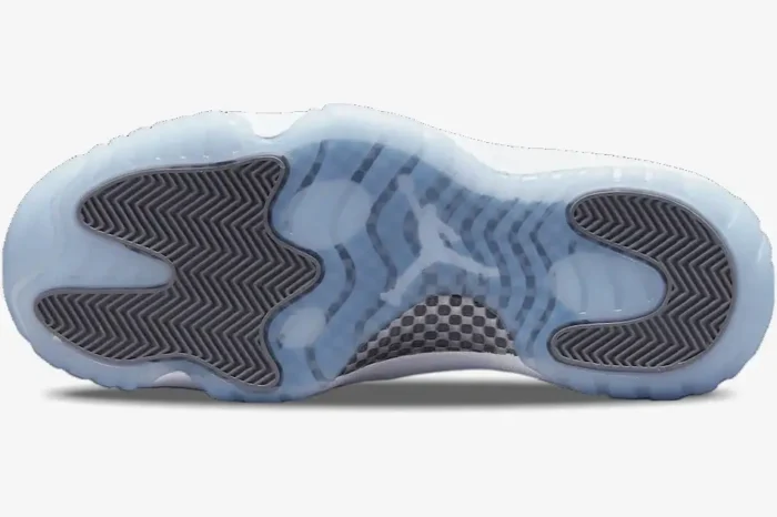 Bottom view of Air Jordan 11 Retro Cool Grey showing icy blue translucent outsole and grey traction pods. - SKU CT8012-005