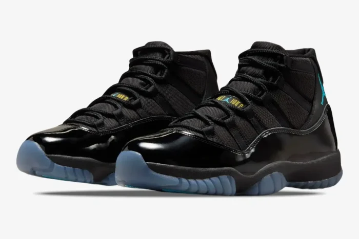 Air Jordan 11 Retro Gamma Blue sneakers in black with blue accents, shown from a three-quarter front angle. - SKU 378037-006