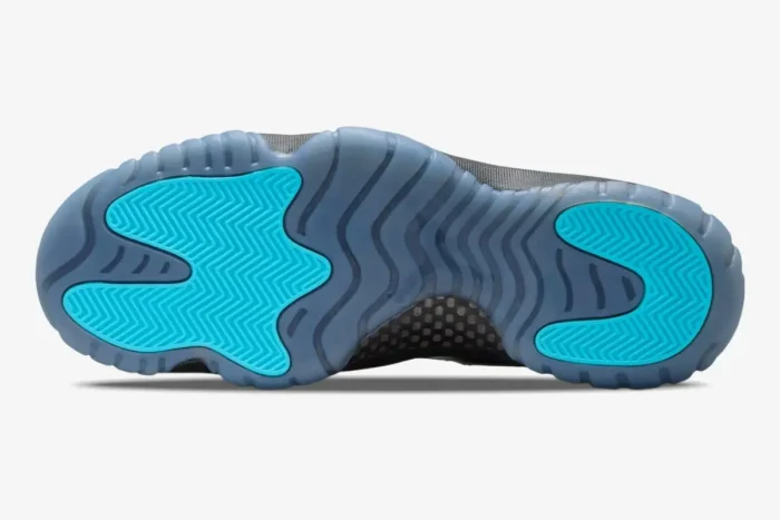 Bottom view of Air Jordan 11 Retro Gamma Blue outsole with teal traction pods and translucent blue rubber. - SKU 378037-006