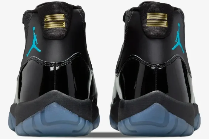 Rear view of Air Jordan 11 Retro Gamma Blue sneakers with black patent leather and blue Jumpman logos. - SKU 378037-006