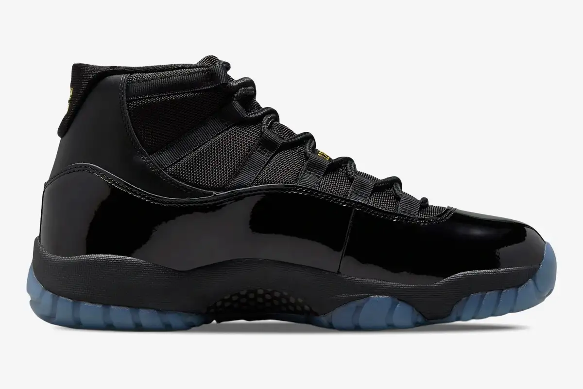 air-jordan-11-retro-gamma-blue-side-view-378037-006-051-780 Side profile of the Air Jordan 11 Retro Gamma Blue sneaker in black with a translucent blue outsole. - SKU 378037-006