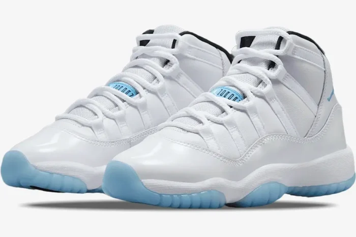 Air Jordan 11 Retro Legend Blue sneakers in white with light blue soles, front three-quarter view. - SKU 378037-117
