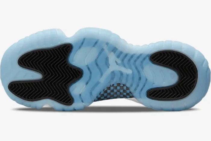 Bottom view of Air Jordan 11 Retro Legend Blue sneakers featuring an icy blue translucent outsole and black traction pods. - SKU 378037-117