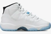 Air Jordan 11 Retro Legend Blue sneaker in white with an icy blue outsole, side profile view. - SKU 378037-117