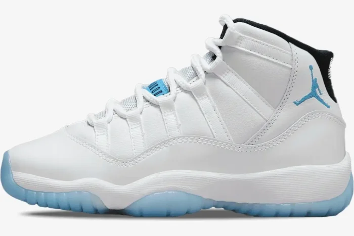 Side profile of Air Jordan 11 Retro Legend Blue sneakers in white with light blue accents. - SKU 378037-117