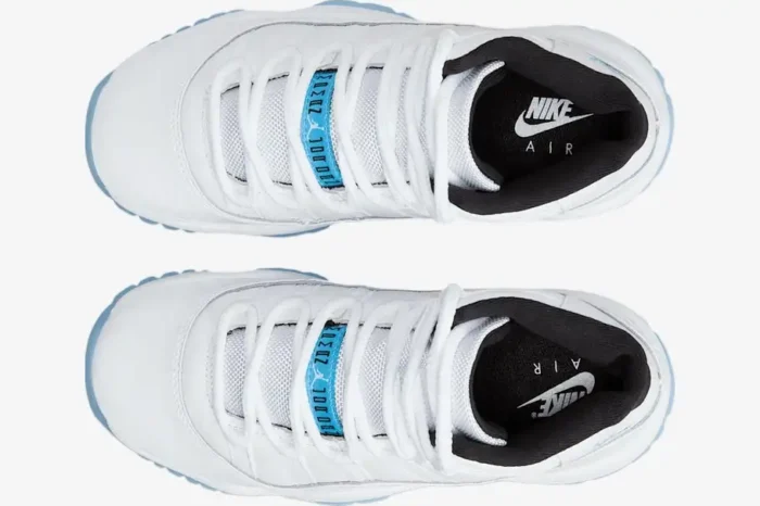 Top-down view of white Air Jordan 11 Retro Legend Blue sneakers with white laces and blue tongue tags. - SKU 378037-117