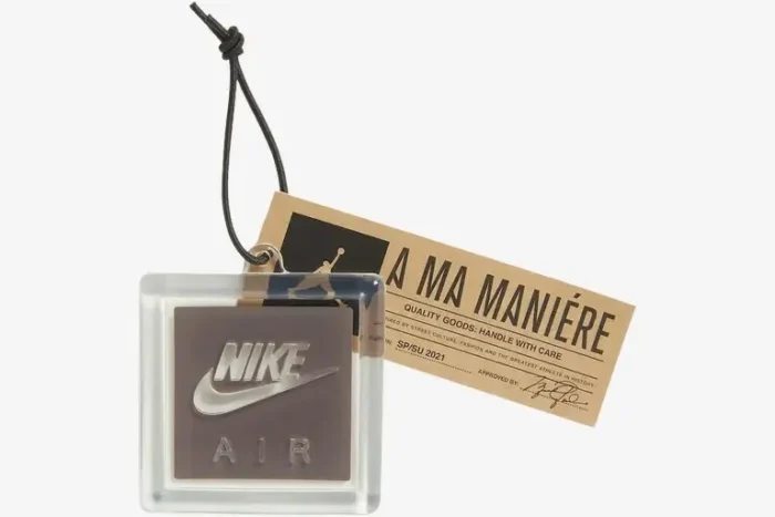 Close-up of Nike Air and A Ma Maniere hangtags for Air Jordan 3 Retro sneakers on a white background. - SKU DH3434-110