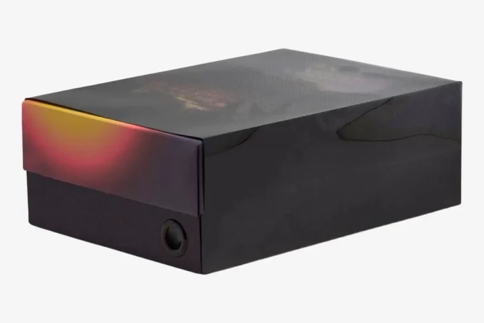 Three-quarter view of the Air Jordan 3 Retro x J Balvin Medellín Sunset shoebox with a colorful gradient lid. - SKU FN0344-901