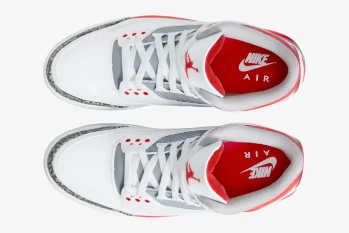 Top-down view of Air Jordan 3 Retro Fire Red OG sneakers in white, red, and grey elephant print. - SKU DN3707-160