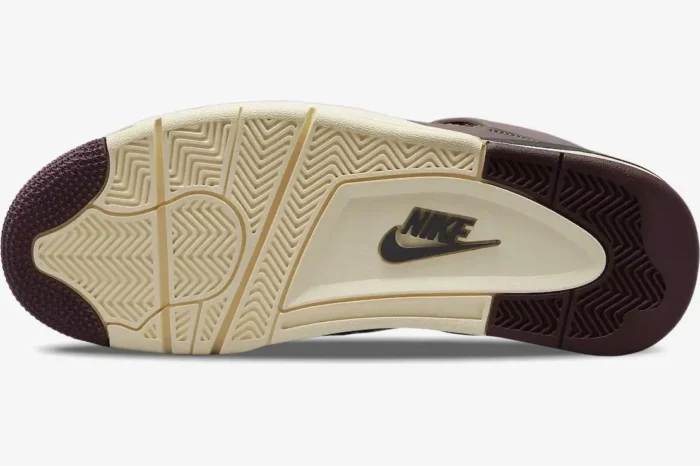 Bottom view of Air Jordan 4 Retro x A Ma Maniére Violet Ore outsole in cream and burgundy with Nike logo. - SKU DV6773-220