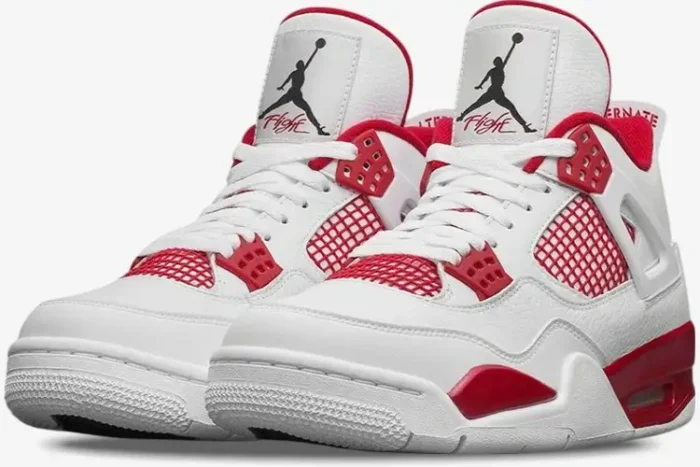 Three-quarter front view of white and red Air Jordan 4 Retro Alternate 89 sneakers with leather uppers. - SKU 308497-106