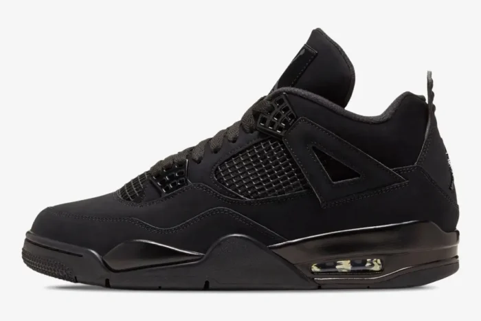 Side profile of the Air Jordan 4 Retro Black Cat sneaker in all-black nubuck with mesh panels. - SKU CU1110-010