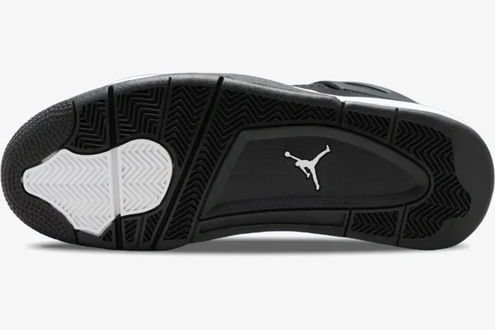 Bottom view of Air Jordan 4 Retro outsole in black and white with white Jumpman logo. - SKU FQ8138-001
