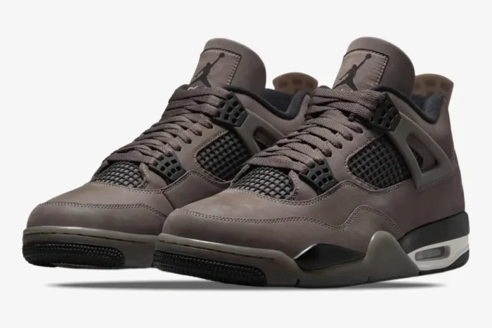 Air Jordan 4 Retro Cave Stone and Black sneakers shown from a three-quarter front perspective. - SKU  FV5029-200