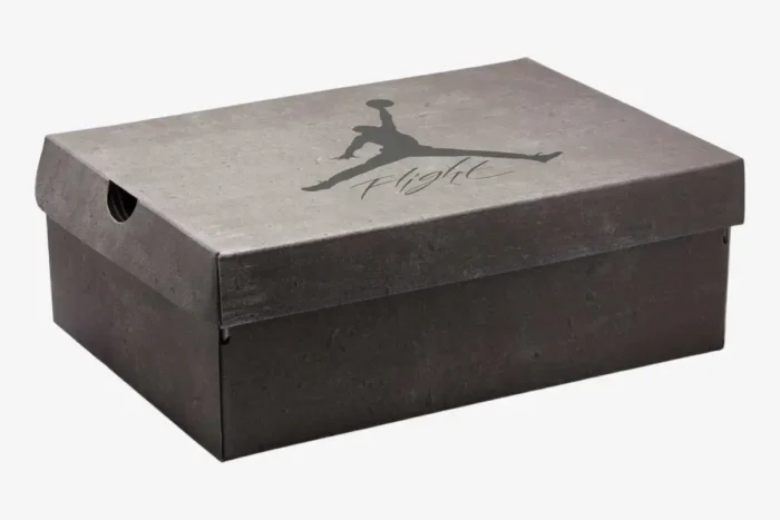 Air Jordan 4 Retro Cave Stone and Black shoe box in a three-quarter perspective view. - SKU  FV5029-200