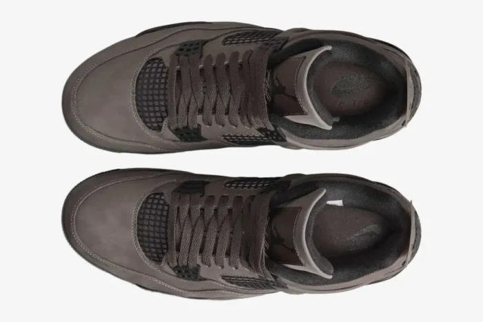Top-down view of Air Jordan 4 Retro Cave Stone and Black sneakers with brown laces. - SKU  FV5029-200
