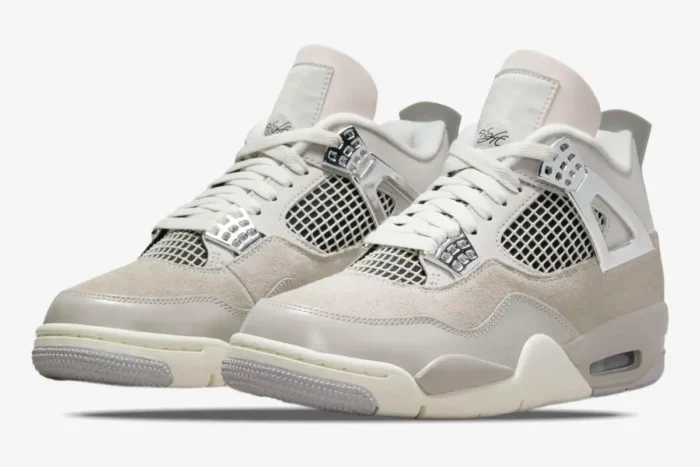 Air Jordan 4 Retro Frozen Moments women's sneakers in light grey and sail, front three-quarter view. - SKU AQ9129-001