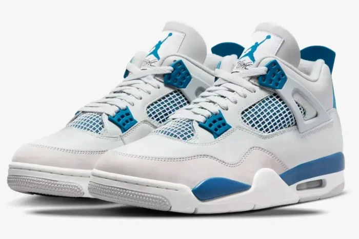 Three-quarter front view of Air Jordan 4 Retro Industrial Blue sneakers with white leather and blue accents. - SKU FV5029-141