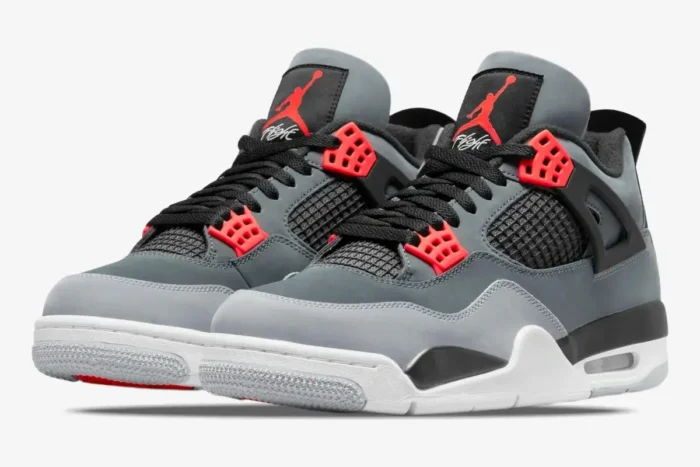 Air Jordan 4 Retro Infrared sneakers in grey and black, three-quarter front view. - SKU DH6927-061