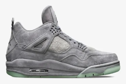 Side profile of the Air Jordan 4 Retro x Kaws in cool grey suede with a translucent green sole. - SKU 930155-003