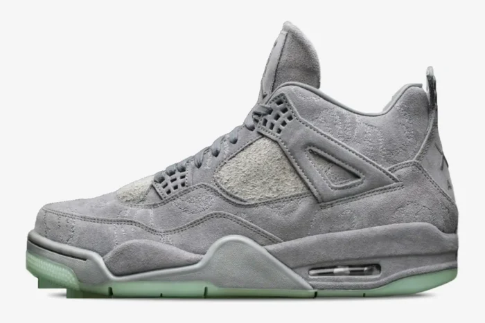 Side profile view of the Air Jordan 4 Retro x Kaws in Cool Grey with premium suede and glow-in-the-dark soles. - SKU 930155-003