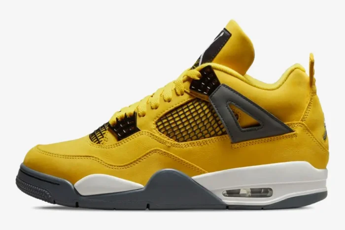 Side profile of the Air Jordan 4 Retro Lightning sneaker in bright yellow with grey and white accents. - SKU CT8527-700