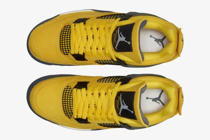 Top-down view of yellow Air Jordan 4 Retro Lightning sneakers with black accents and yellow laces. - SKU CT8527-700
