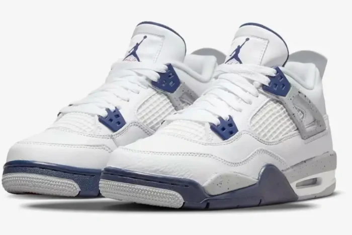 Air Jordan 4 Retro Midnight Navy sneakers in white and navy blue, three-quarter front view. - SKU DH6927-140