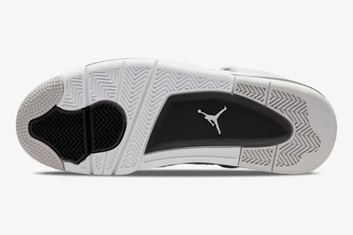 Bottom view of Air Jordan 4 Retro Military Black outsole featuring white, black, and grey traction patterns. - SKU DH6927-111